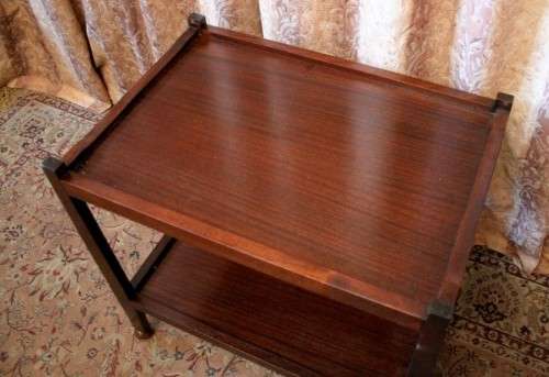 A lovely vintage wooden butlers trolley on wheels, perfect drinks/snacks trolley.