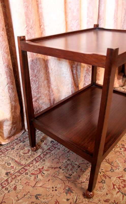 A lovely vintage wooden butlers trolley on wheels, perfect drinks/snacks trolley.