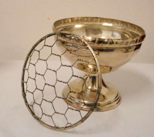 Two stunning vintage silver plated flower frogs with mesh lids