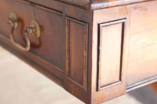 A beautiful vintage Regency styled ladies embossed leather-top 3-drawer writing desk on castors