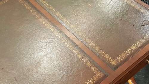 A beautiful vintage Regency styled ladies embossed leather-top 3-drawer writing desk on castors