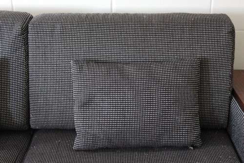 A stylish black and grey combination "Moxi "double-sleeper couch with wooden armrests & cushions