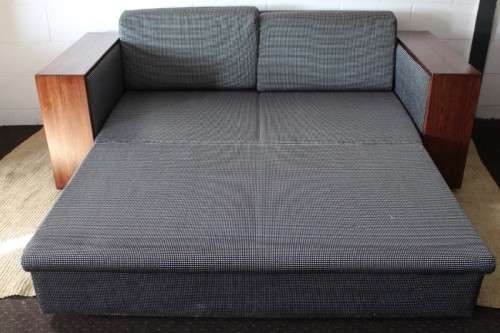 A stylish black and grey combination "Moxi "double-sleeper couch with wooden armrests & cushions