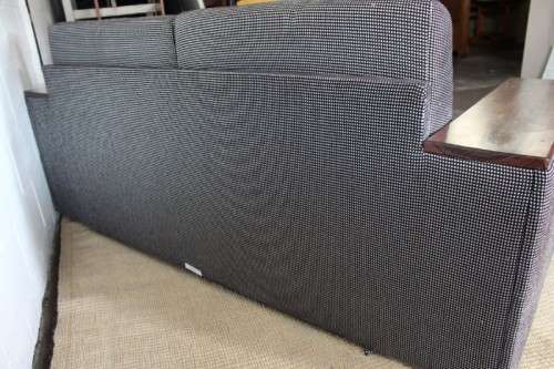 A stylish black and grey combination "Moxi "double-sleeper couch with wooden armrests & cushions