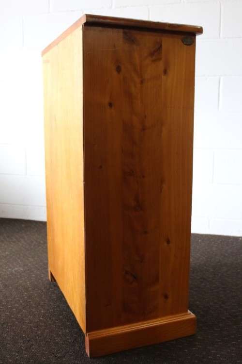 An incredible and beautifully made solid oregon wood 30-bottle wine rack with a smalls drawer
