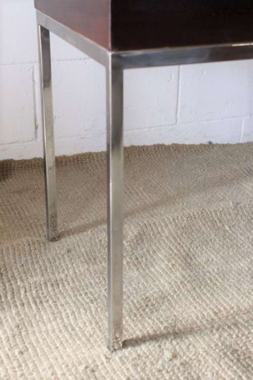 A fabulous pair of modern styled chromed-framed coffee tables with a broad wood profiles