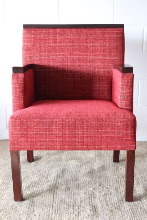 An awesome & stylish mid-century styled red-upholstered club armchair w/ mahogany armrests
