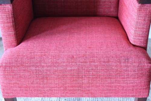 An awesome & stylish mid-century styled red-upholstered club armchair w/ mahogany armrests