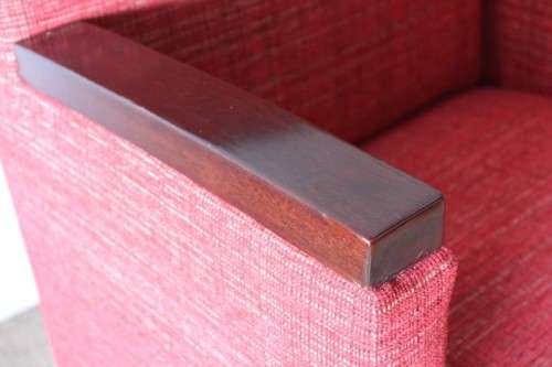An awesome & stylish mid-century styled red-upholstered club armchair w/ mahogany armrests