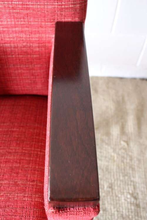 An awesome & stylish mid-century styled red-upholstered club armchair w/ mahogany armrests