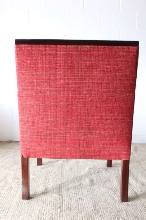 An awesome & stylish mid-century styled red-upholstered club armchair w/ mahogany armrests