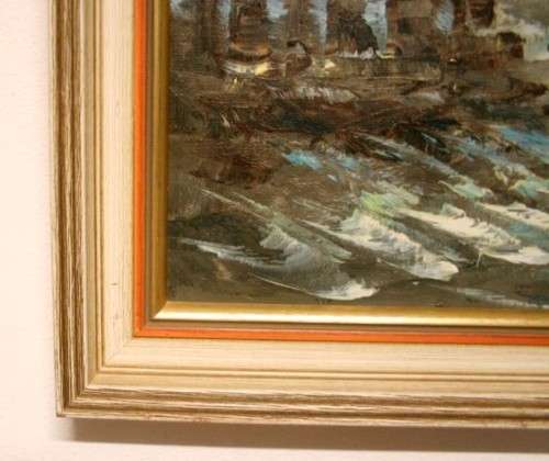 A beautiful framed original signed oil painting of a town scene.
