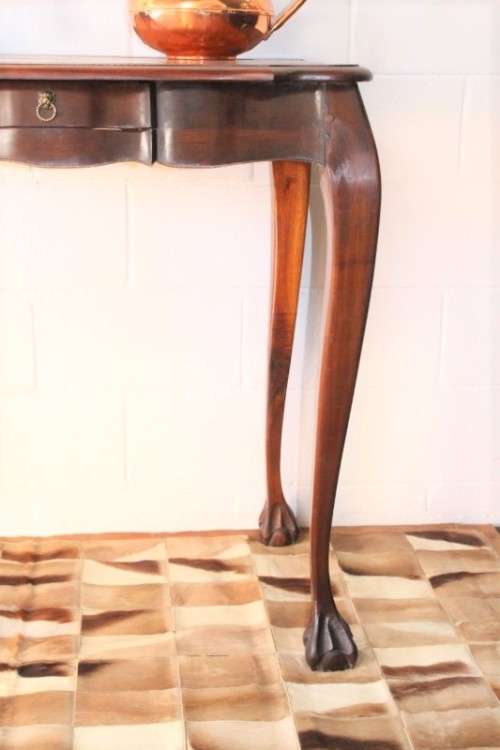 A beautiful tall (91cm) antique solid stink-wood & yellow-wood ball and claw hall table w/ a drawer