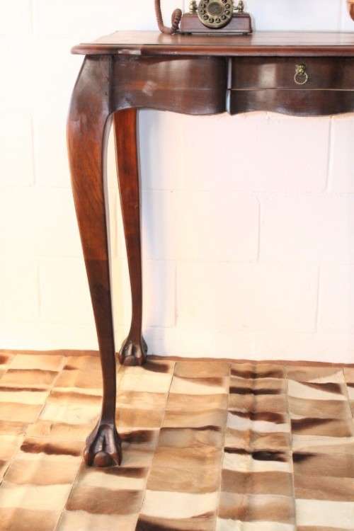 A beautiful tall (91cm) antique solid stink-wood & yellow-wood ball and claw hall table w/ a drawer