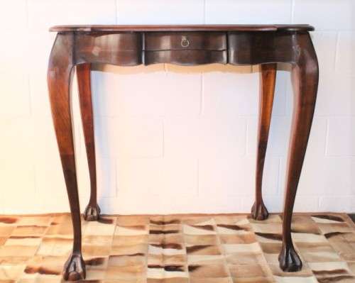 A beautiful tall (91cm) antique solid stink-wood & yellow-wood ball and claw hall table w/ a drawer
