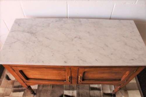 A wonderful vintage solid Oak double door wash stand with a white marble top on castors - stunning!
