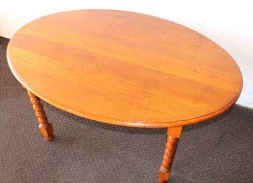 An exquisite antique Edwardian solid English honeyed oak bobbin-leg 6-seater dining table