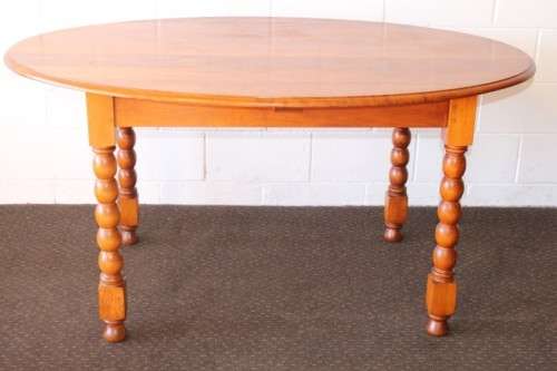 An exquisite antique Edwardian solid English honeyed oak bobbin-leg 6-seater dining table