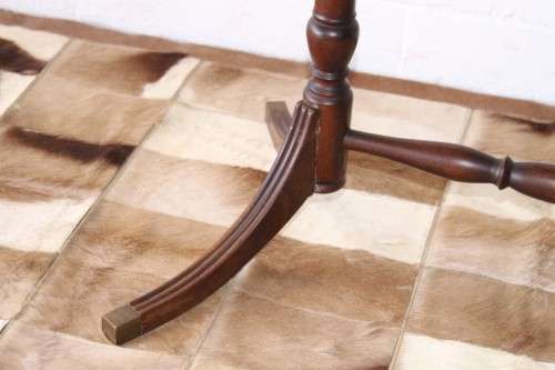 A wonderful vintage Regency style oval coffee table with brass-caped toes and rail inlay detailing