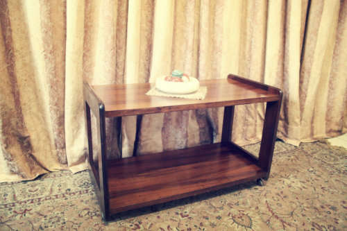 A lovely stylish Teak all purpose TV stand/occasional table on wheels.