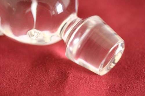 A beautifully made hand-created crystal decanter/ bottle stopper in the shape of an apple