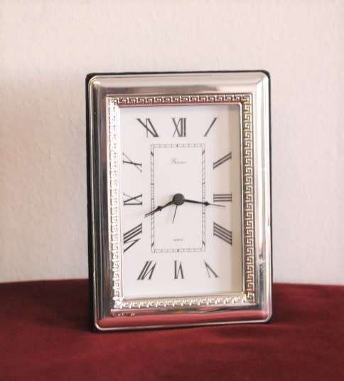 A stunning ornately detailed sterling silver framed "Florence" free-standing quartz alarm clock