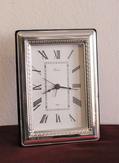 A stunning ornately detailed sterling silver framed "Florence" free-standing quartz alarm clock