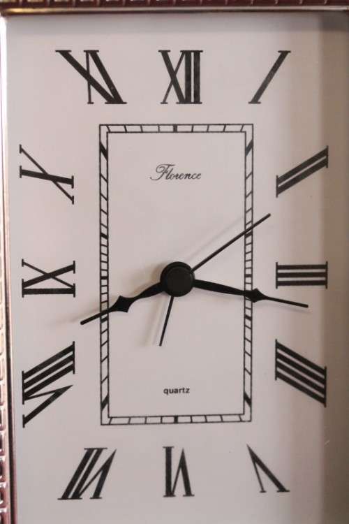 A stunning ornately detailed sterling silver framed "Florence" free-standing quartz alarm clock