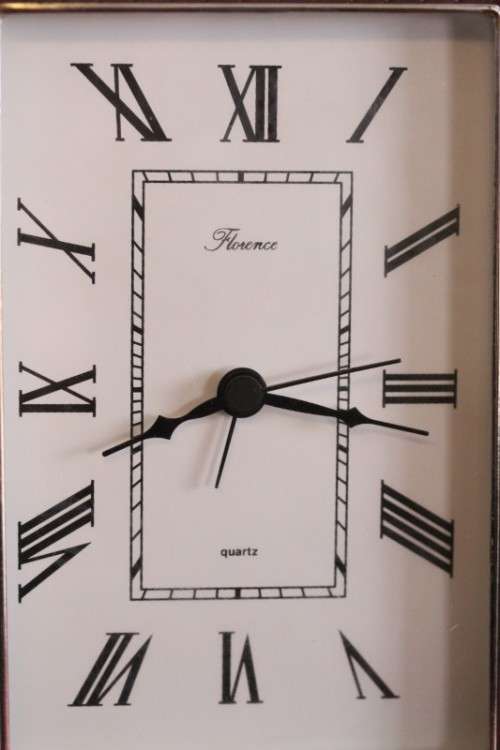 A stunning ornately detailed sterling silver framed "Florence" free-standing quartz alarm clock