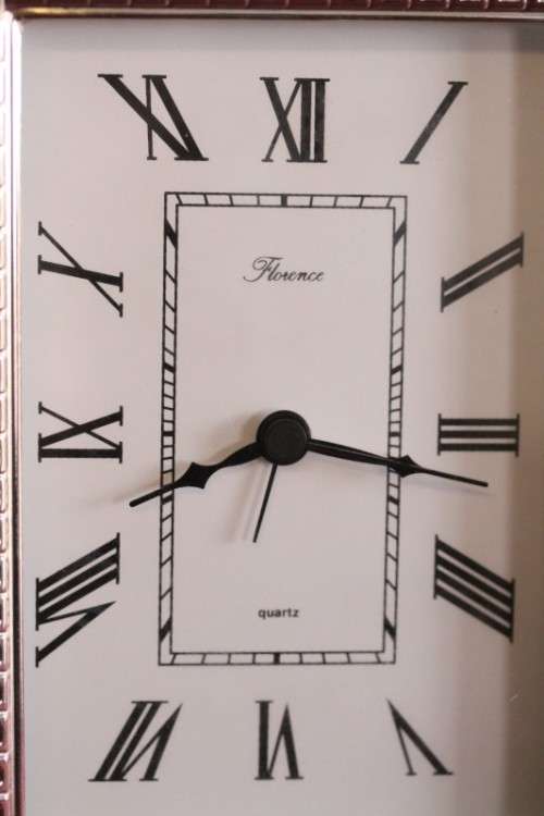 A stunning ornately detailed sterling silver framed "Florence" free-standing quartz alarm clock