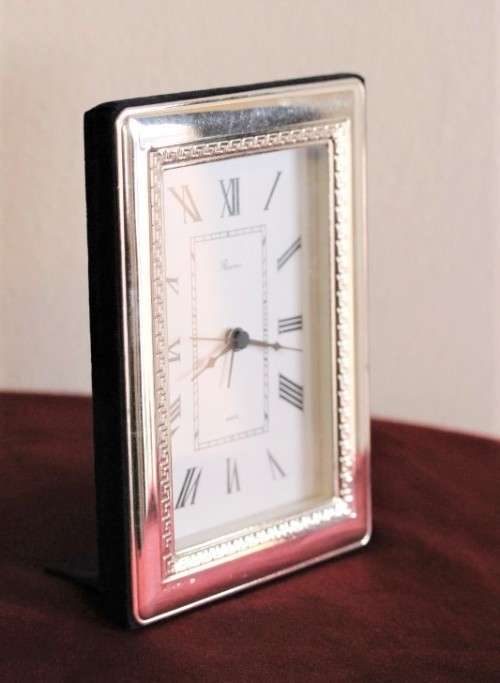 A stunning ornately detailed sterling silver framed "Florence" free-standing quartz alarm clock