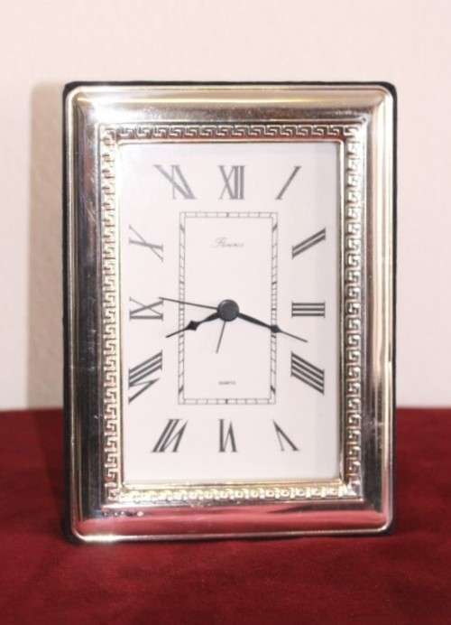 A stunning ornately detailed sterling silver framed "Florence" free-standing quartz alarm clock