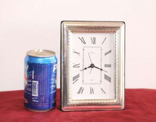 A stunning ornately detailed sterling silver framed "Florence" free-standing quartz alarm clock