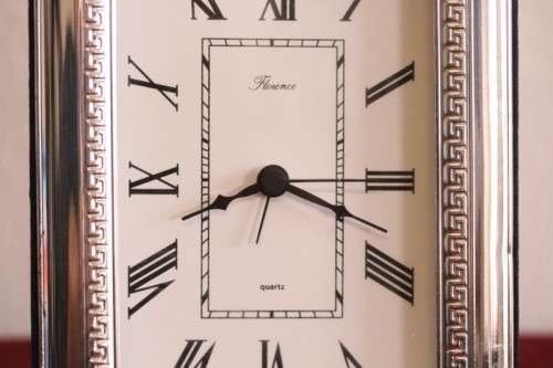 A stunning ornately detailed sterling silver framed "Florence" free-standing quartz alarm clock