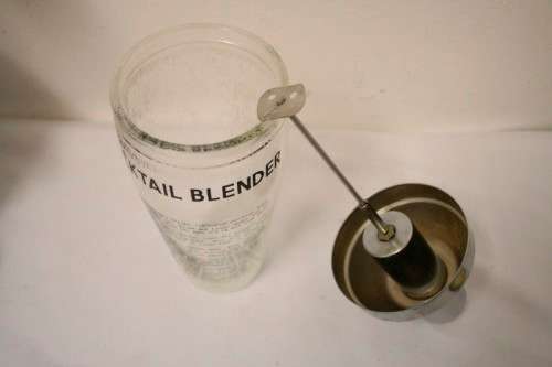 **RS17** A pair of vintage glass cocktail shakers w printed cocktail recipes & measurements markings