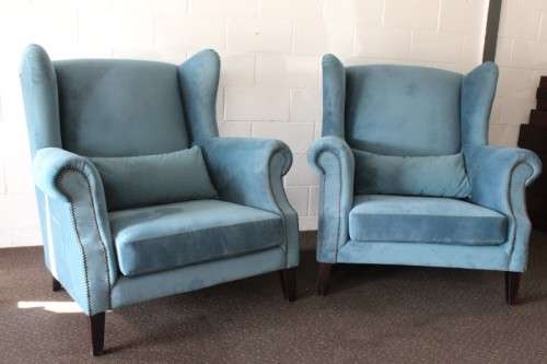 Two superb large top-end wing-back armchairs upholstered in a quality blue fabric - price per chair