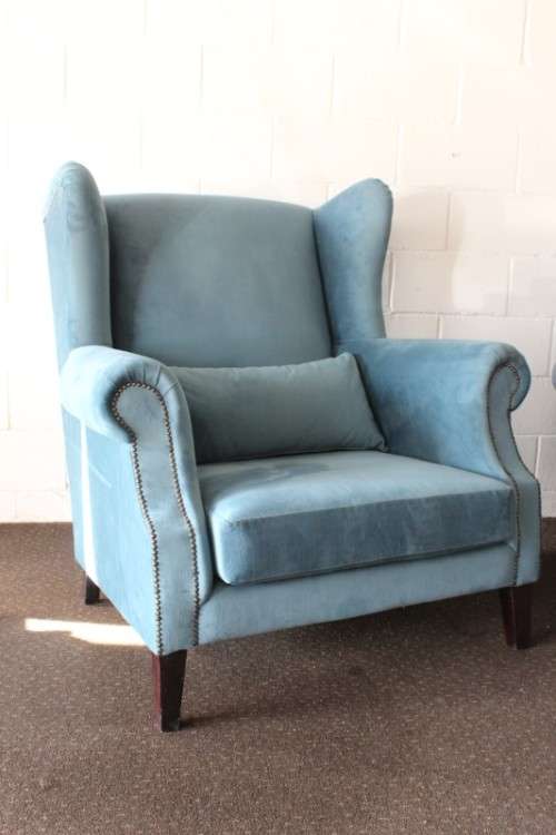 Two superb large top-end wing-back armchairs upholstered in a quality blue fabric - price per chair