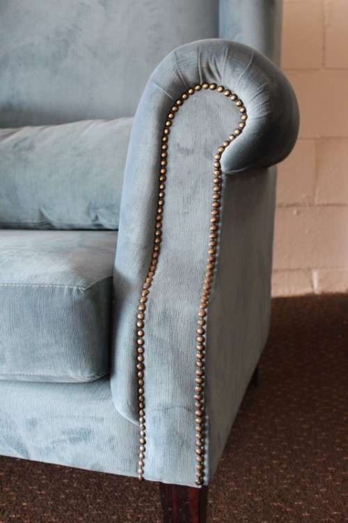 Two superb large top-end wing-back armchairs upholstered in a quality blue fabric - price per chair