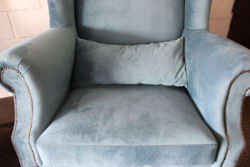 Two superb large top-end wing-back armchairs upholstered in a quality blue fabric - price per chair