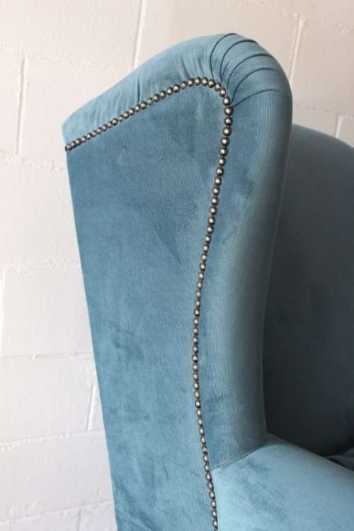 Two superb large top-end wing-back armchairs upholstered in a quality blue fabric - price per chair