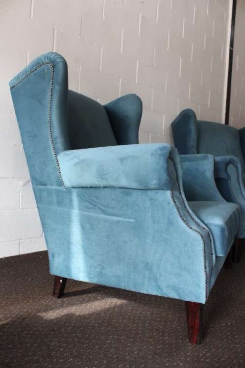 Two superb large top-end wing-back armchairs upholstered in a quality blue fabric - price per chair