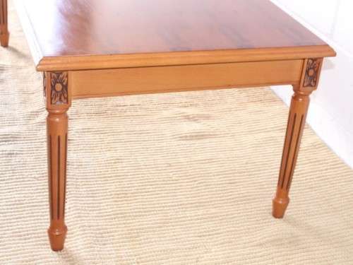 A stunning and stylish Yew wood centre coffee table with carved detailing on tapered legs