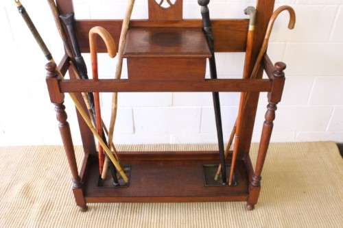 An incredible solid Oak hall stand with a bevelled mirror, "drawer" & six hooks for hats and coats!