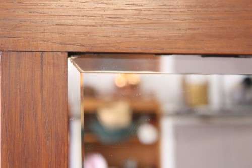 An incredible solid Oak hall stand with a bevelled mirror, "drawer" & six hooks for hats and coats!