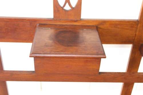 An incredible solid Oak hall stand with a bevelled mirror, "drawer" & six hooks for hats and coats!
