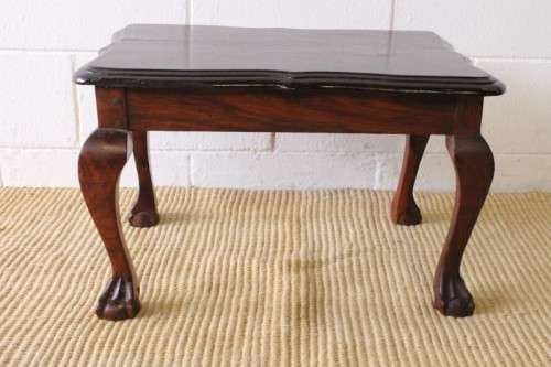 A beautiful vintage scalloped edge solid African Stink wood ball and claw coffee/ side table