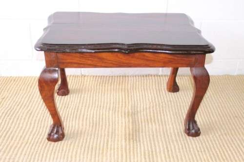 A beautiful vintage scalloped edge solid African Stink wood ball and claw coffee/ side table