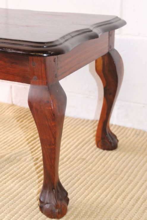 A beautiful vintage scalloped edge solid African Stink wood ball and claw coffee/ side table