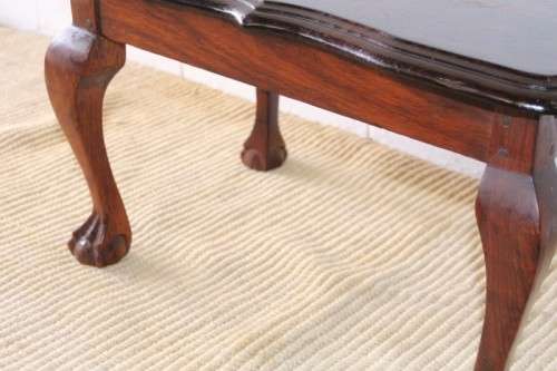 A beautiful vintage scalloped edge solid African Stink wood ball and claw coffee/ side table