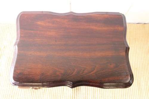 A beautiful vintage scalloped edge solid African Stink wood ball and claw coffee/ side table